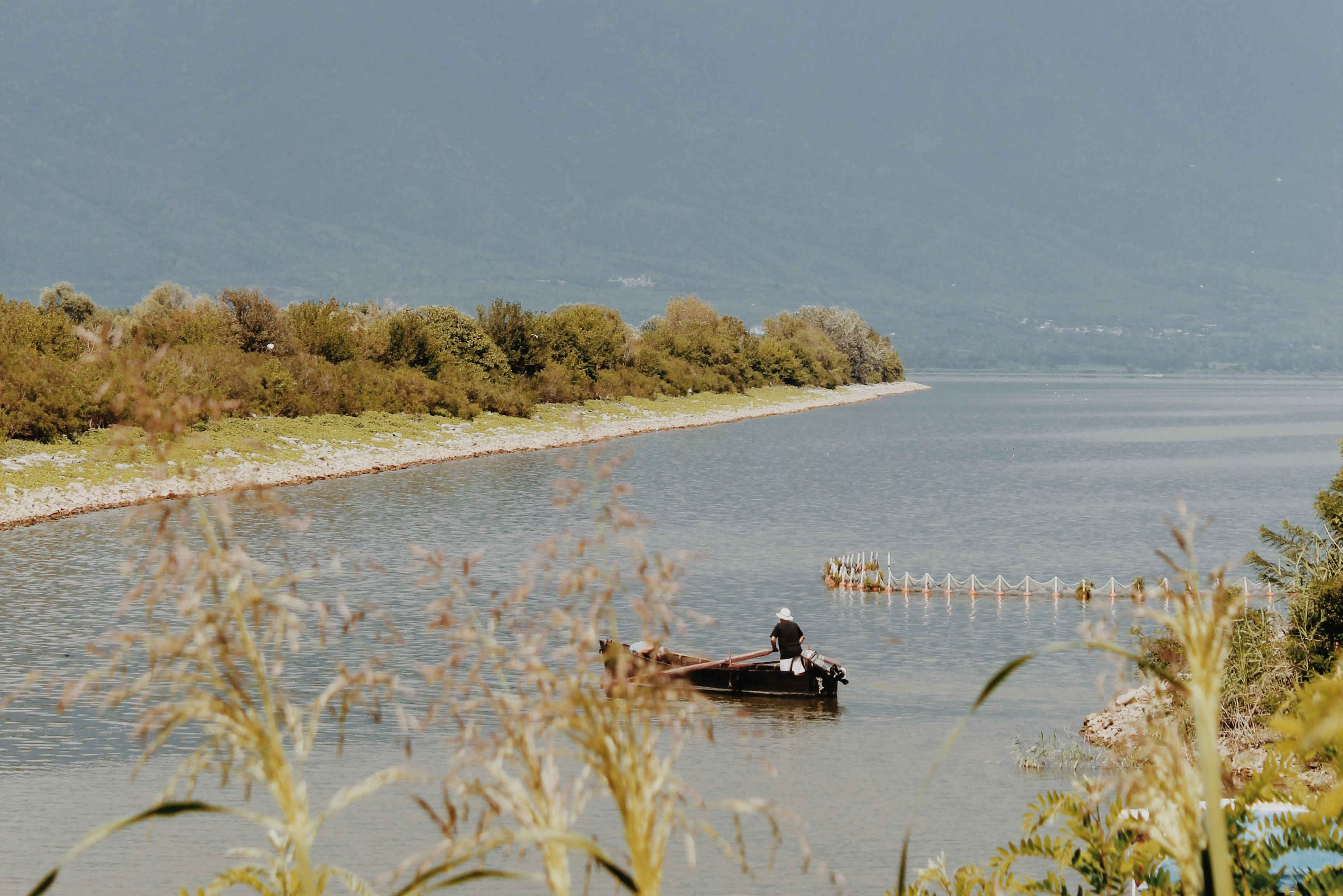 people riding boat on river during daytime